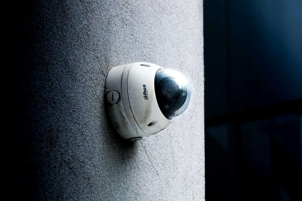 pexels photo 29866272 29866272 Close-up view of a dome security camera mounted on a concrete wall for surveillance.